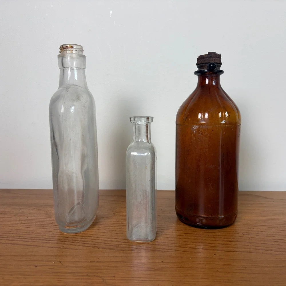 Vintage Glass Bottle Trio Amber and Clear Apothecary Medicine Bottles Set of 3